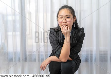 Little Entrepreneur Asian Eyeglasses Woman With Confident Pose In Black Suit Stands In Front Of Wind