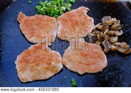 Fresh Meat And Mushrooms On Metal Saj.