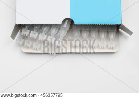 Package With Single Dose Ampoules Of Sterile Isotonic Sea Water Solution On White Background, Top Vi