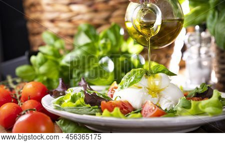 Salad With Tomatoes, Burrata, Basil, Olive Oil. Middle Name Burratina. Traditional Cheese From The S