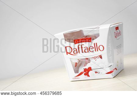Raffaello Sweets On A Light Wooden Table And White Background.