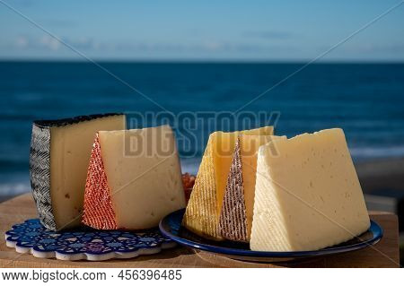 Assortment Of Spanish Hard Cheeses, Curado, Manchego, Goat Cheese Served Outdoor With Membrillo Jam