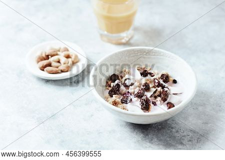 Bowl Of Granola With Yogurt, Nuts, Cranberry And Cocoanut. Concept For A Tasty And Healthy Meal. Sto