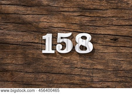Number 158 In Wood, Isolated On Rustic Background