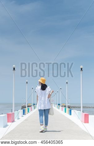The Back View Of Asian Woman Walking On The Rainbow Bridge To See The Viewpoint At The Samut Sakorn 