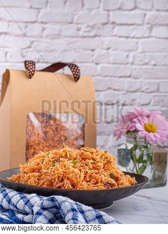Sweet And Sour Crispy Noodles Or Mee Krob In The Thai Language On A Dish With Cloth, Vase Placed On 