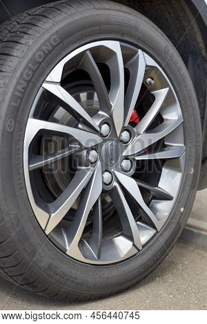 Russia, Izhevsk - August 14, 2020: Geely Showroom. The Wheel Of New Coolray Car. Alloy Wheel And Lin