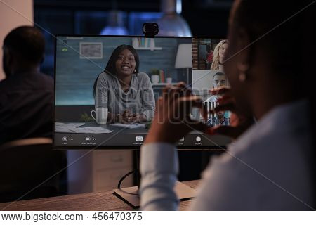 Female Freelancer Meeting On Online Teleconference Chat With Business People, Using Videoconference 