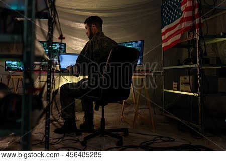 American Hacker In Military Unifrorm On Dark Web, Cyberwar Concept.