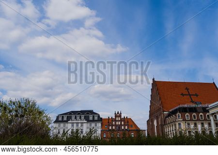 Church St Dorothea Near Buildings With Sky At Background In Wroclaw