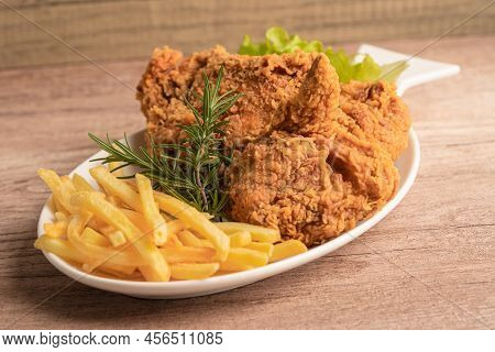 Fried Chicken And Potato Chip With Rosemary Leaf, Junk Food High Calorie Served On White Plate