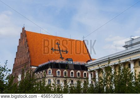 Church St Dorothea Near Buildings And Blurred Bushes In Wroclaw