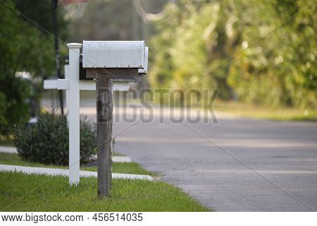 Typical American Outdoors Mail Box On Suburban Street Side