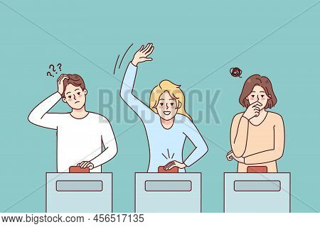 Diverse People Participate In Quiz Show Answering Questions. Men And Women Take Part In Gambling Gam
