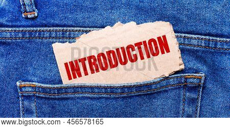 In The Back Pocket Of The Jeans There Is A Brown Piece Of Paper With The Text Introduction