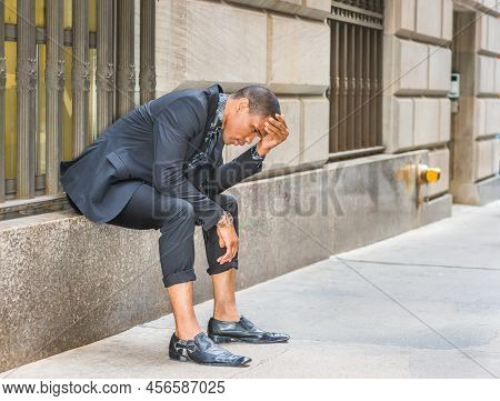 African American Businessman In New York. Wearing Black Suit, Tie, Leather Shoes, Wristwatch, Young 