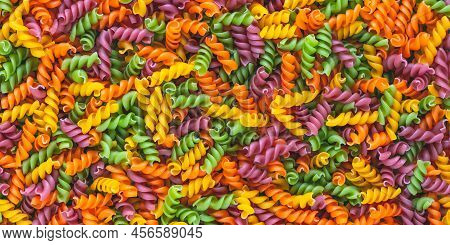 Italian Pasta Pattern, Colorful Background. Various Colors Of Fusilli Viewed From Above. Top View. M