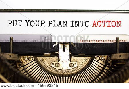Put Your Plan Into Action Symbol. Concept Words Put Your Plan Into Action Typed On Old Retro Typewri