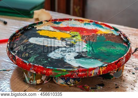 Bright Spots Of Paint In An Art Workshop