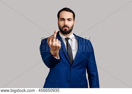 Portrait Of Strict Serious Rude Bearded Man Looking At Camera And Showing Middle Finger, Expressing 