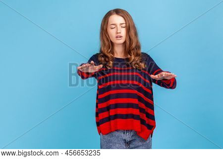 Portrait Of Lonely Blind Disabled Woman Wearing Striped Sweater, Standing With Closed Eyes And Outst
