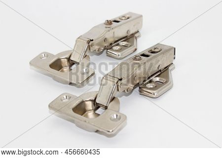 A Picture Of Stainless Steel Hydraulic Hinges With Selective Focus