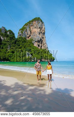 Railay Beach Krabi Thailand, The Tropical Beach Of Railay Krabi, A Couple Of Men And Woman On The Be