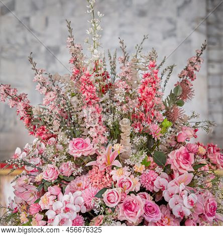 Big Bouquet Of Flowers In A Vase On A Gray Wall Background