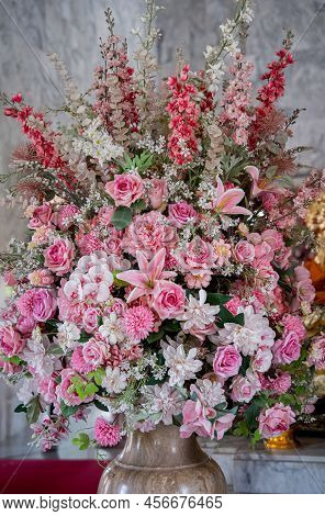 Big Bouquet Of Flowers In A Vase On A Gray Wall Background