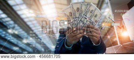 Businessman Holding Banknote And Investment On Business Global Network, And Chart Currency Exchange,