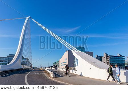 Dublin, Ireland - June 1, 2022: People Walking On Samuel Beckett Bridge Across The River Liffey In D