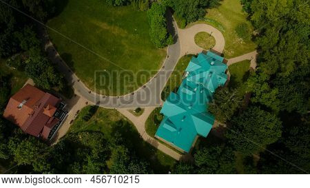 Flight Over The City Park. You Can See Park Buildings. Aerial Photography.