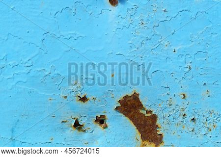 Texture Of The Old Blue Paint Is A Rusty Surface. Grunge Background With Space For Design