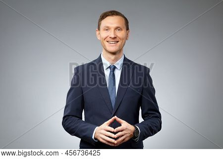 Photo Realistic Digital Collage Of Confident Businessman With  Artificial Face Of Asian Eth