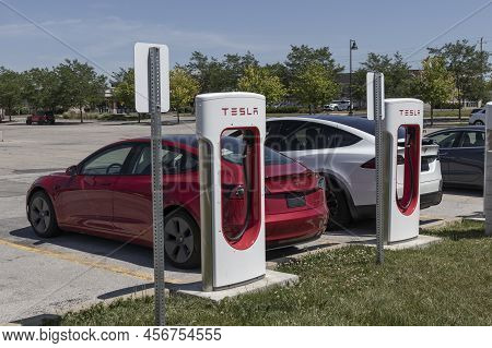 Zionsville - Circa June 2022: Tesla Ev Electric Vehicle Charging. Tesla Products Include Electric Ca