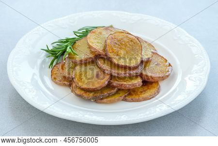 Portion Of Fried Sliced Potatoes On The Plate
