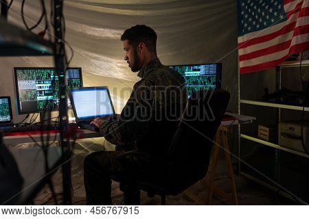 American Hacker In Military Unifrorm On Dark Web, Cyberwar Concept.