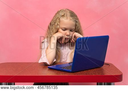 Sad, Brooding Schoolgirl Behind The Lepton. Pink Background.