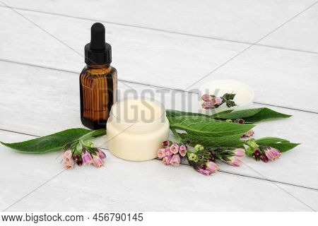 Comfrey Herb Ointment Used In Herbal Plant Medicine To Treat Skin Conditions, Burns, Swelling, Sprai