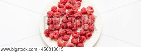 Frozen Raspberry On White Plate In White Background. Banner. View From Above. Copy Space.