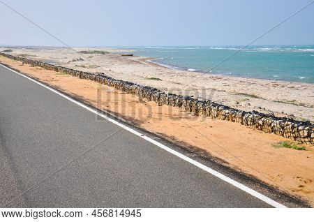 Asphalt Road And Sandy Shore Overlooking The Indian Ocean At Arichal Munai, Dhanushkodi, Tamil Nadu,