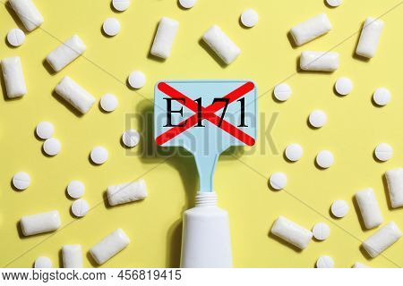 Titanium Dioxide, E171, Dangerous Additive Concept. Gum, Pills, Toothpaste Or Cream And Sign With E1