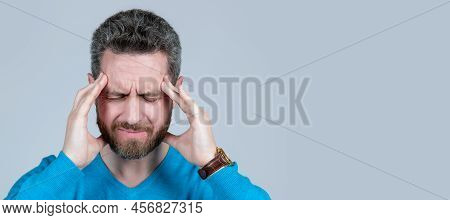 Mature Man With Beard Suffer From Headahce On Grey Background, Health. Man Face Portrait, Banner Wit