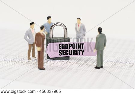The Concept Of Security In Business. There Are Figures Of People On Business Reports, A Padlock With