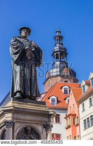 Statue Of Martin Luther In Front Of The Andreas Church In Eisleben, Germany