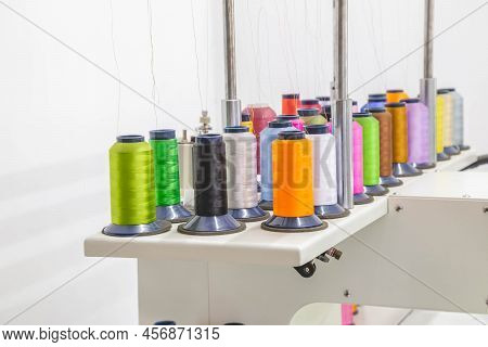 The Embroidery Machine In The Workshop Embroiders With Threads On Fabric