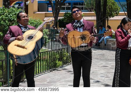 Tlacolula, Oaxaca, Mexico- May 23, 2022: Members Of Mariachi Posing At The Camera Outside Of Parroqu