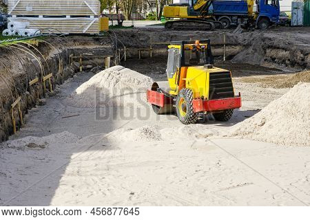Construction Pit Of A New Building With A Heavy Compaction Roller, Sand Piles And Dewatering System 