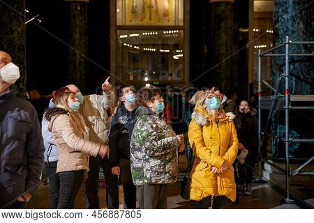 Belgrade, Serbia - January 6, 2022: Selective Blur On A Family Praying For Orthodox Christmas (badnj