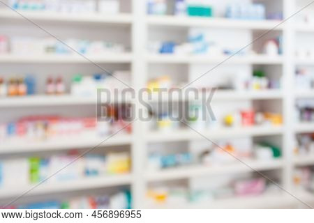 Pharmacy Drugstore Blur Abstract Backbround With Medicine And Healthcare Product On Shelves